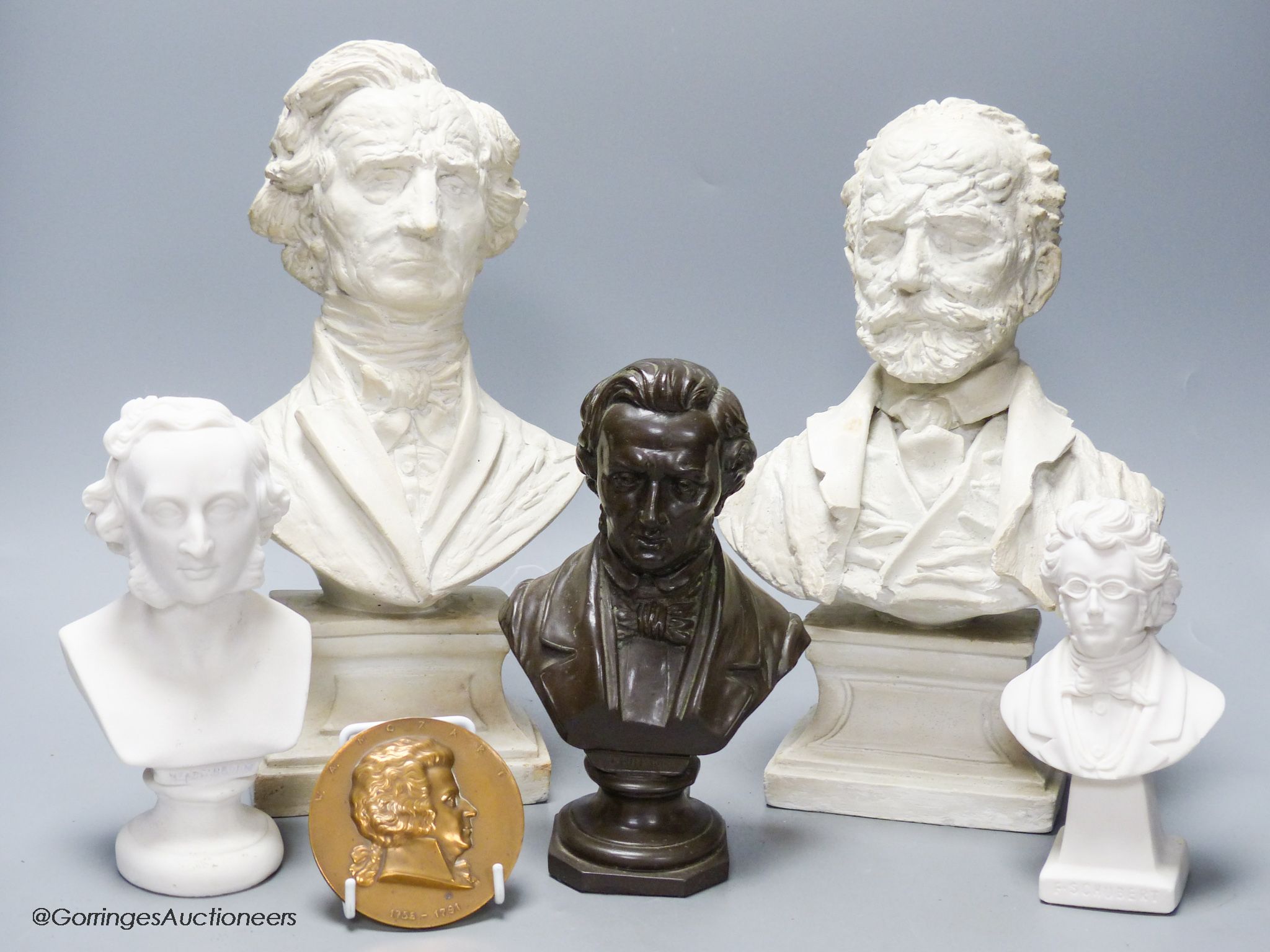 Five composition or ceramic busts of composers